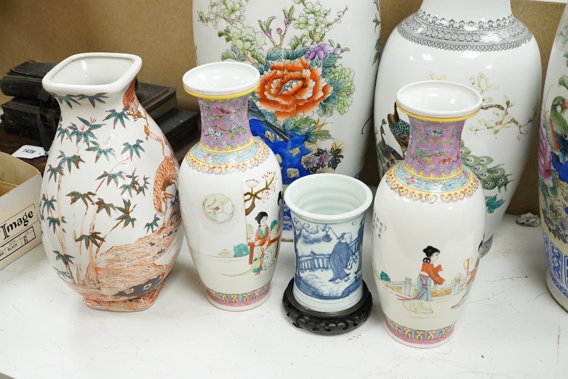 A large pair of Chinese polychrome vases, 60cm high, a pair of famille rose vases, a blue and white brushpot and two other vases (7).